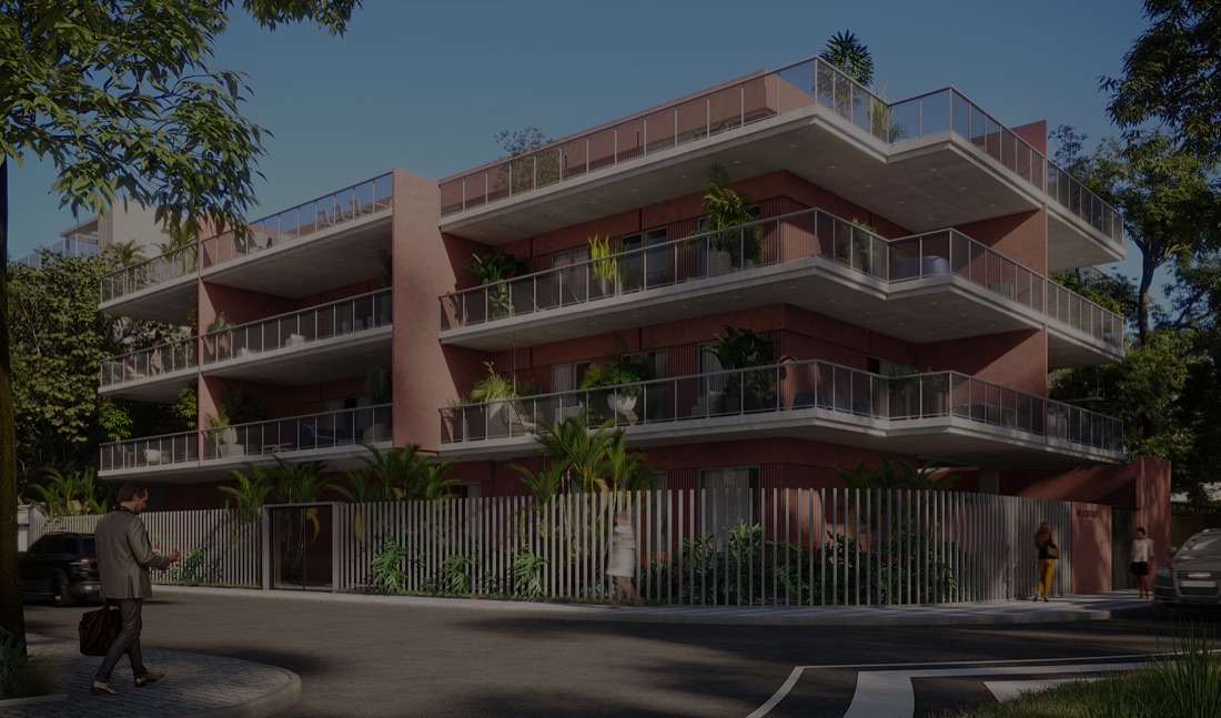 Fachada do Dezoito, de tom rosado, com varandas e jardins